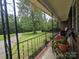 Inviting porch features wrought iron railings and a cozy seating area perfect for enjoying the outdoors at 3116 Pilgrim Rd, Chester, SC 29706