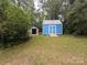 Blue shed with a metal roof and a ramp for access, plus an additional storage shed at 3116 Pilgrim Rd, Chester, SC 29706