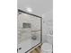 Modern bathroom featuring a glass-enclosed shower with marble-look tile and a white toilet at 314 Euclid Ave, Statesville, NC 28677