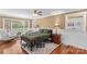 Inviting bedroom featuring hardwood floors, two windows, a ceiling fan, and a comfortable queen-sized bed at 314 Euclid Ave, Statesville, NC 28677