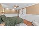 Comfortable bedroom features a ceiling fan, neutral color walls, and hardwood flooring at 314 Euclid Ave, Statesville, NC 28677