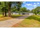 Charming single story home featuring a well maintained front yard, long driveway, and detached garage at 314 Euclid Ave, Statesville, NC 28677