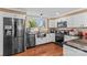 Modern kitchen with stainless steel appliances, custom cabinetry, and a window view at 314 Euclid Ave, Statesville, NC 28677