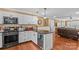 Modern kitchen featuring white cabinets, granite countertops, stainless steel appliances, and a beverage fridge at 314 Euclid Ave, Statesville, NC 28677