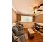 This living room features a gray couch, ottoman, hardwood floors, and a modern entertainment center with fireplace at 314 Euclid Ave, Statesville, NC 28677