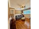 A comfortable living room with a gray couch, decorative pillows, and hardwood floors with a table and lamp at 314 Euclid Ave, Statesville, NC 28677