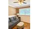 A comfortable living room with a gray couch, decorative pillows, an ottoman, and a side table with a lamp at 314 Euclid Ave, Statesville, NC 28677