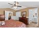 Spacious main bedroom featuring a ceiling fan, wood-look floors, ample storage and ensuite bathroom at 314 Euclid Ave, Statesville, NC 28677
