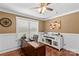 Office features a dark wood desk and chair, neutral walls, hardwood flooring, and a modern printer at 314 Euclid Ave, Statesville, NC 28677