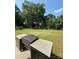 This outdoor kitchen features a built-in Blackstone grill, perfect for outdoor entertaining on a lush green lawn at 314 Euclid Ave, Statesville, NC 28677