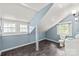 Cozy bathroom with unique angles, slate floors, and natural light from multiple windows at 319 S Oakland St, Gastonia, NC 28052