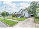 Classic craftsman-style home with inviting front porch, landscaped yard, and detached garage at 319 S Oakland St, Gastonia, NC 28052