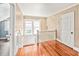Well-lit hallway with hardwood floors and access to multiple rooms at 319 S Oakland St, Gastonia, NC 28052