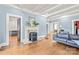 Bright living room with a decorative fireplace, hardwood floors, and classic design, perfect for comfortable living at 319 S Oakland St, Gastonia, NC 28052