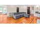 Spacious living room with hardwood floors, featuring a comfortable sectional sofa and access to other rooms at 319 S Oakland St, Gastonia, NC 28052