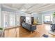 Spacious living room with hardwood floors and plenty of natural light, perfect for entertaining guests at 319 S Oakland St, Gastonia, NC 28052