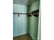 Empty closet with a wooden shelf and wooden bar to hang clothes on at 33 Honeysuckle Ln, Taylorsville, NC 28681