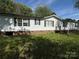 This charming home has a brick foundation and beautiful, lush green grass at 33 Honeysuckle Ln, Taylorsville, NC 28681