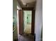 Hallway with open doorways leading to multiple rooms in the home at 33 Honeysuckle Ln, Taylorsville, NC 28681