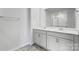 A modern bathroom with dual sinks, and generous counterspace, offers contemporary convenience at 3402 Lacebark Ln, Gastonia, NC 28056