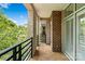 A beautiful balcony features red brick wall and a decorative concrete floor at 400 N Church St # 226, Charlotte, NC 28202