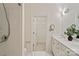 Bright bathroom with double sink vanity, tiled shower and closet, offers great style at 400 N Church St # 226, Charlotte, NC 28202