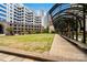 Inviting community green space with shade structures and walkable paths amidst skyscrapers at 400 N Church St # 226, Charlotte, NC 28202