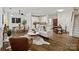 An inviting living room with an open layout, featuring hardwood floors, a modern sofa, and a stylish dining area at 400 N Church St # 226, Charlotte, NC 28202