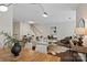 A modern living area with an open layout, featuring hardwood floors, stylish furniture, and stairs to the upper level at 400 N Church St # 226, Charlotte, NC 28202
