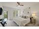 Bedroom features balcony access, plantation shutters, ceiling fan, and comfortable contemporary furnishings at 400 N Church St # 226, Charlotte, NC 28202