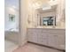 Well-lit bathroom with double vanity, modern fixtures, and a view to the adjacent space at 5508 Kincross Ln, Charlotte, NC 28277