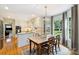 Eat-in kitchen area with stainless appliances and view to a lush green backyard at 5508 Kincross Ln, Charlotte, NC 28277