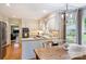 Eat-in kitchen with white cabinetry and a casual dining table near a window at 5508 Kincross Ln, Charlotte, NC 28277