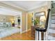 Elegant foyer with hardwood floors, stylish decor, and open doorways to the living room, enhancing the home's flow at 5508 Kincross Ln, Charlotte, NC 28277
