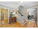 Charming foyer with hardwood floors, decorative mirror, and staircase, seamlessly connecting to other living spaces at 5508 Kincross Ln, Charlotte, NC 28277