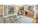 Inviting living room with French doors, hardwood floors, and comfortable seating, providing a seamless transition to other areas at 5508 Kincross Ln, Charlotte, NC 28277