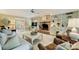 Spacious living room with a brick fireplace, built-in shelves, and neutral tones, creating a cozy and inviting atmosphere at 5508 Kincross Ln, Charlotte, NC 28277