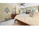 Bright main bedroom with hardwood furnishings, a four-poster bed, and tasteful decor at 5508 Kincross Ln, Charlotte, NC 28277