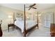 Inviting main bedroom featuring a four-poster bed, neutral tones, and ample closet space at 5508 Kincross Ln, Charlotte, NC 28277