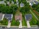Aerial view of neighborhood featuring mature trees, well-manicured lawns, and sidewalks at 5656 Cambridge Bay Dr, Charlotte, NC 28269