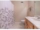 Bright bathroom featuring toilet, tile floor, neutral paint, and shower with floral curtain at 5656 Cambridge Bay Dr, Charlotte, NC 28269
