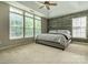 Inviting bedroom featuring lots of natural light, a decorative accent wall, and a cozy gray queen bed at 5656 Cambridge Bay Dr, Charlotte, NC 28269