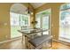 Cozy breakfast nook with natural light, table, and bench seating at 5656 Cambridge Bay Dr, Charlotte, NC 28269