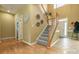 Inviting foyer with staircase, natural light, and stylish decor at 5656 Cambridge Bay Dr, Charlotte, NC 28269