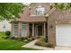 Charming brick home entrance featuring a 'Welcome' sign, flower accents and a beautiful bay window feature at 5656 Cambridge Bay Dr, Charlotte, NC 28269