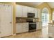 Well-lit kitchen boasts granite counters, stainless appliances, and ample cabinet space at 5656 Cambridge Bay Dr, Charlotte, NC 28269