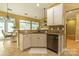 Stylish kitchen featuring granite counters, stainless dishwasher, and bright breakfast area at 5656 Cambridge Bay Dr, Charlotte, NC 28269