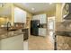 Bright kitchen featuring granite counters, tile backsplash and modern appliances at 5656 Cambridge Bay Dr, Charlotte, NC 28269