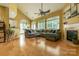 Spacious living room with vaulted ceilings, fireplace, hardwood floors, and large windows at 5656 Cambridge Bay Dr, Charlotte, NC 28269
