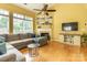 Comfortable living room highlighting fireplace, entertainment center, and hardwood floors at 5656 Cambridge Bay Dr, Charlotte, NC 28269